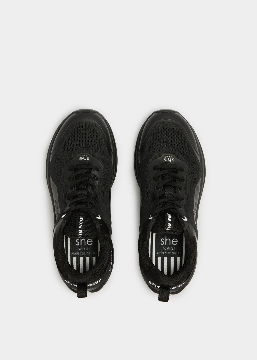 Birds eye view  of vegan friendly walking shoe in black