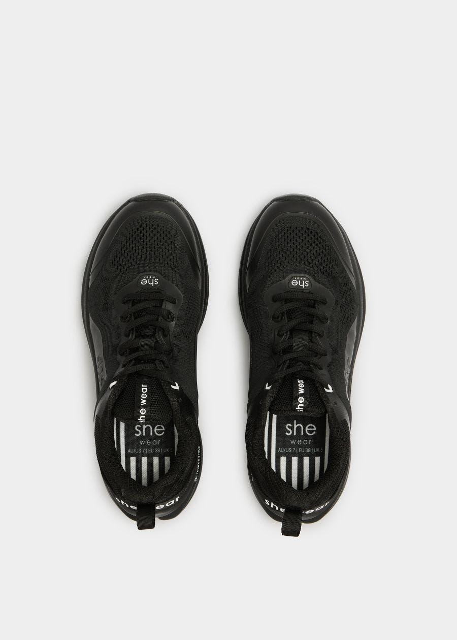 Birds eye view  of vegan friendly walking shoe in black