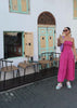 woman travelling comfortably with her she wear rise pastel coloured sneakers