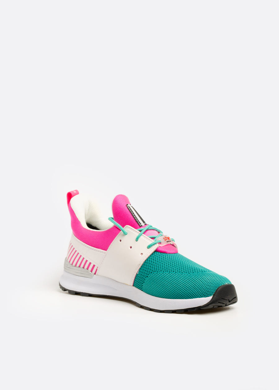 3/4 view of pink, white and teal coloured athletic walking shoe