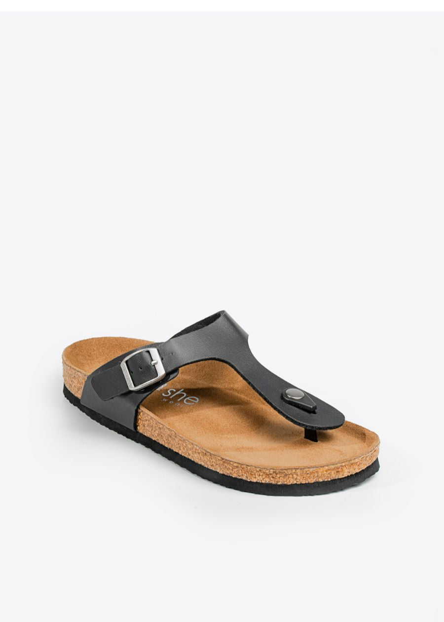 Women's black slip-on fashion sandals with silver buckle and details.